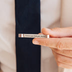 Hand holding a custom Handwriting Tie Clip engraved with Forever your little girl, Ava ♡ in cursive script—a heartfelt personalized gift perfect for any occasion.