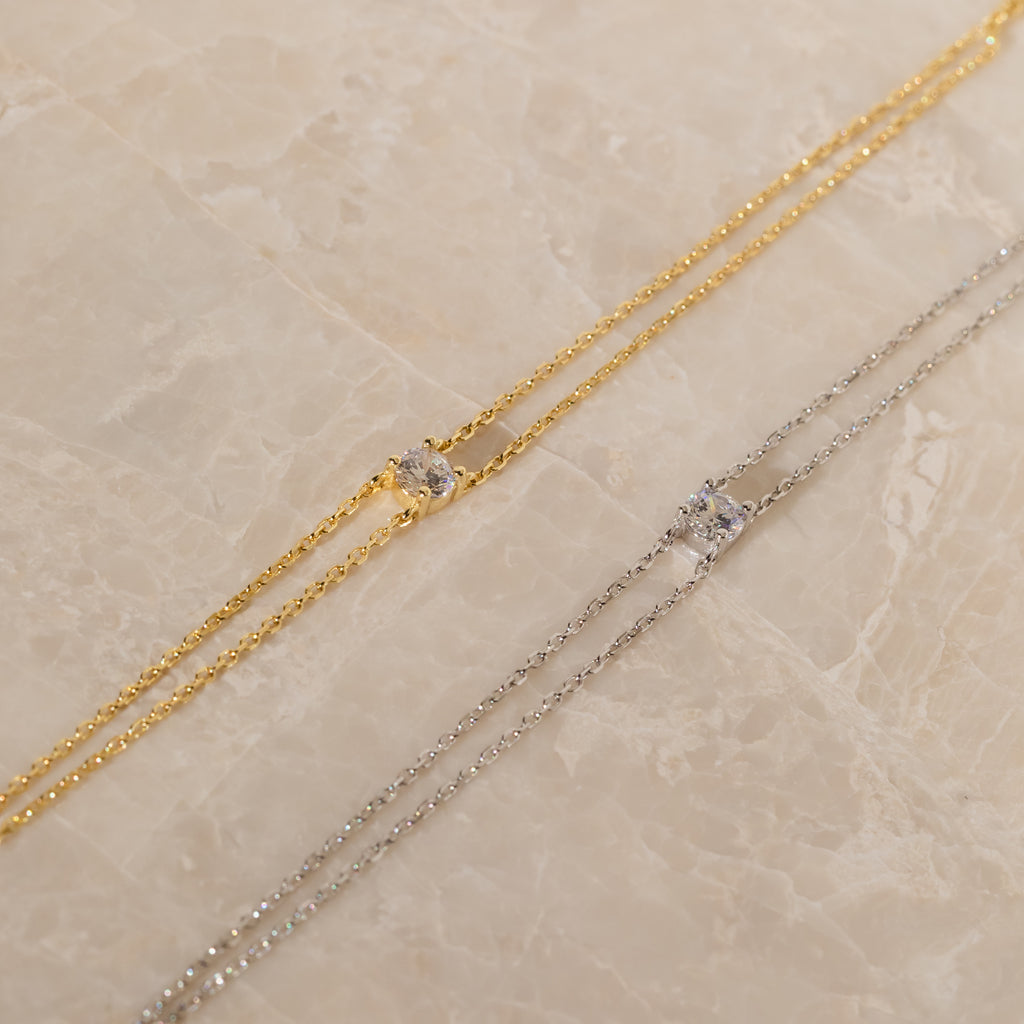 The Duo Chain Diamond Bracelet, with its gold and silver chains accented by sparkling diamonds, is an elegant choice for an anniversary gift or to pair perfectly with your favorite minimalist accessories.