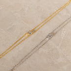 The Duo Chain Diamond Bracelet, with its gold and silver chains accented by sparkling diamonds, is an elegant choice for an anniversary gift or to pair perfectly with your favorite minimalist accessories.