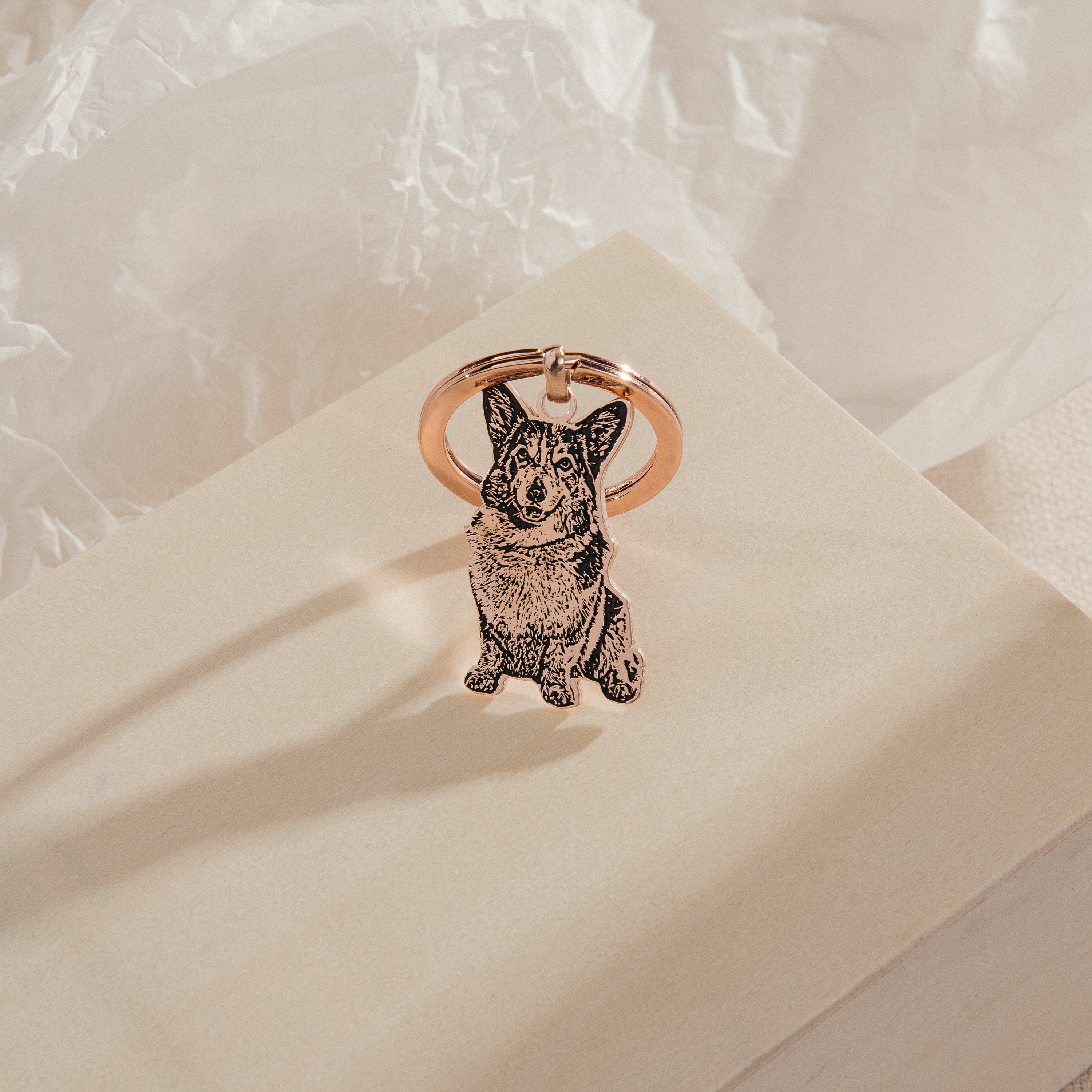 The Custom Pet Keychain features an engraved illustration of a corgi dog on a neutral background—a delightful personalized keepsake for any dog lover.