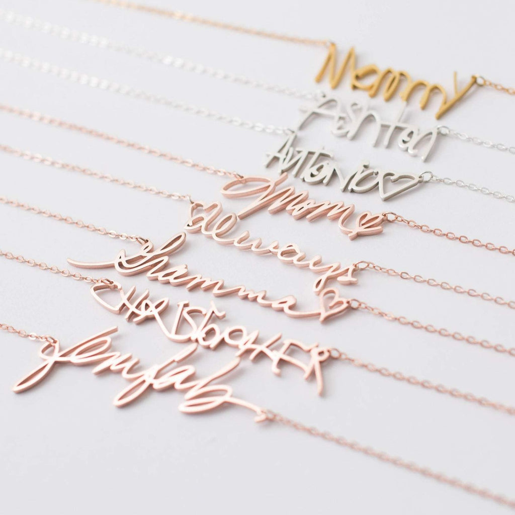 The Handwriting Necklace features delicate chains with script words like Nanny, Mom, Always, and Glmfab—perfect as a sentimental gift or personalized jewelry for someone special.