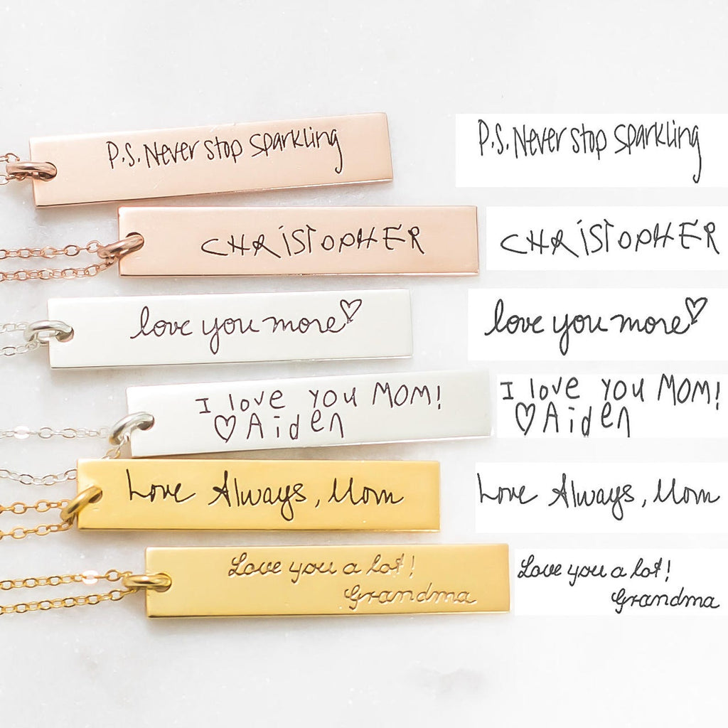 Four Vertical Handwriting Bar Necklaces rest beside handwritten notes with messages like "Love Always, Mom" and "P.S. Never stop sparkling"—a beautiful example of personalized jewelry with a meaningful custom touch.