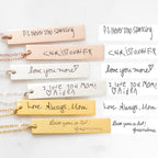 Four Vertical Handwriting Bar Necklaces rest beside handwritten notes with messages like "Love Always, Mom" and "P.S. Never stop sparkling"—a beautiful example of personalized jewelry with a meaningful custom touch.