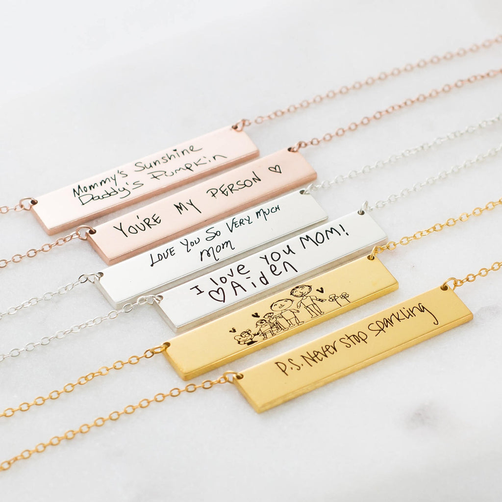 Give a meaningful gift with the Handwriting Bar Necklace in Rose Gold—personalized with engraved names, drawings, or handwritten notes. Find this perfect piece in our personalized jewelry collection.