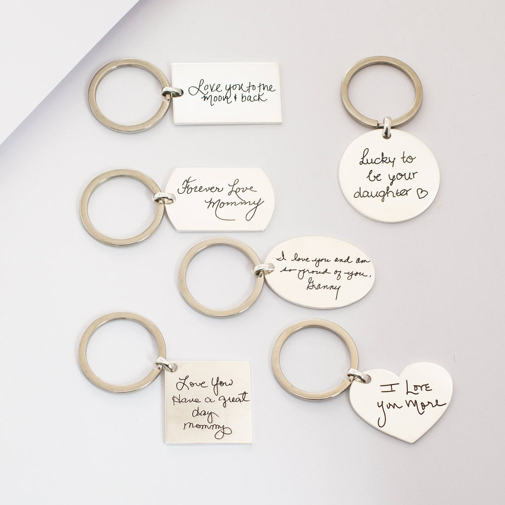 Six Handwriting Circle Keychains with handwritten sentimental messages for moms and daughters are displayed on a light surface, making each personalized keychain a meaningful keepsake.