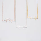 The Heartbeat Necklace features three pendants—one heart-shaped, one plain, and one gold—making it a unique piece of voice jewelry and a thoughtful personalized gift.