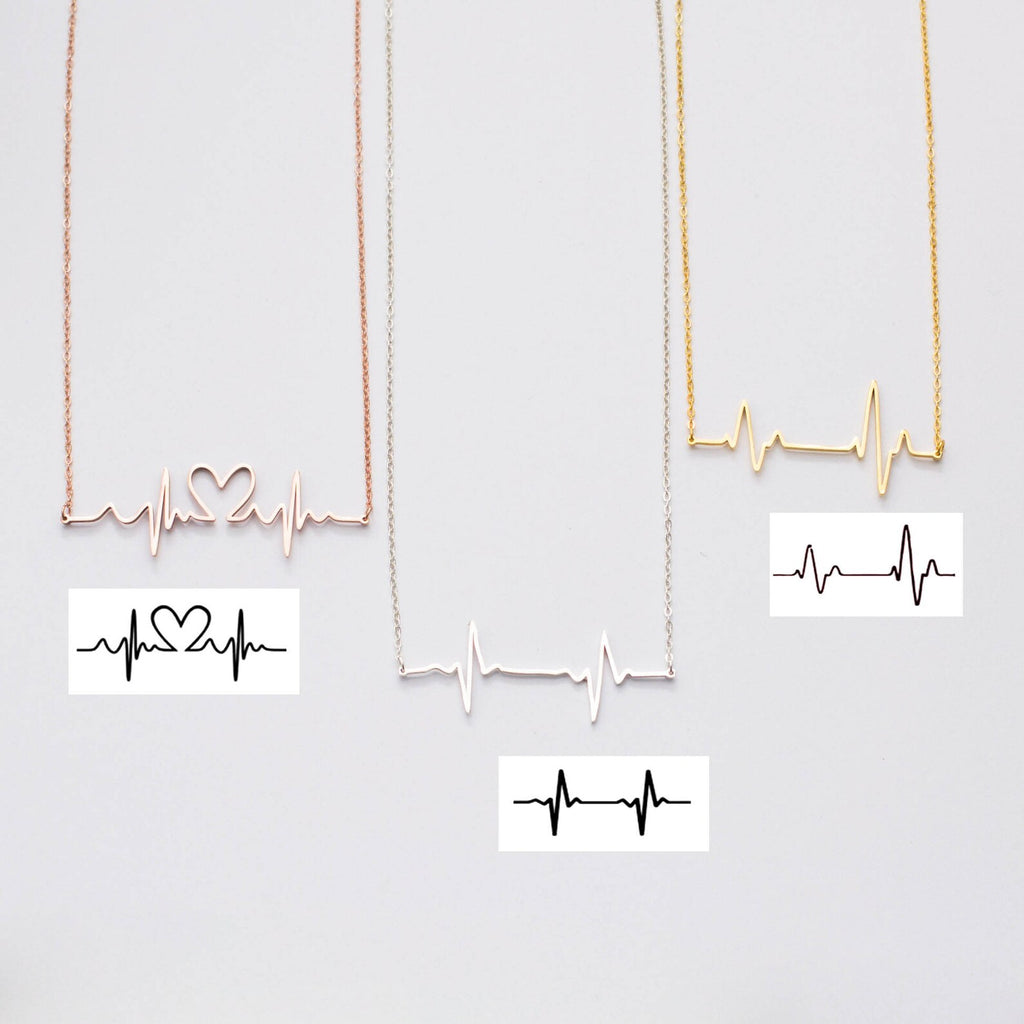 The Heartbeat Necklace features three stunning pendants in gold, silver, and rose gold—an elegant jewelry collection and a unique personalized gift for any occasion.