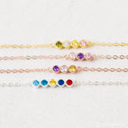 The Multiple Birthstone Necklace features five colorful gemstones in a delicate row, making it a thoughtful gift for new moms or anyone who loves the charm of personalized jewelry.