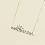 City Skyline Necklace featuring a pendant with iconic buildings and a bridge—a unique cityscape accessory that makes a perfect personalized gift.