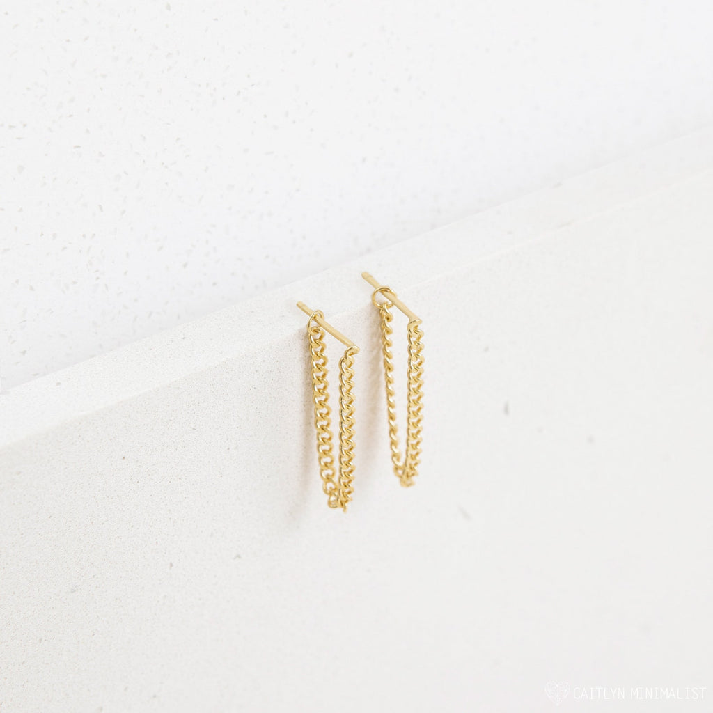 Curb Chain Studs shown on a white textured surface—these minimalist earrings are versatile for daily wear or make a thoughtful personalized gift.