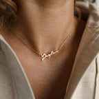 Close-up of the Minimal Name Necklace featuring "Peyton" in gold, elegantly worn around the neck—a personalized and meaningful gift for any occasion.