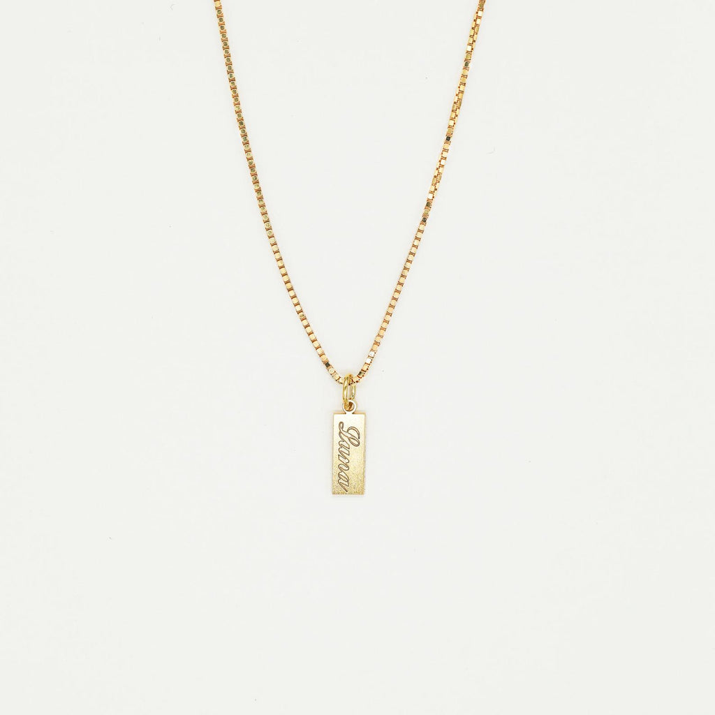 The Dainty Tag Name Necklace in Rose Gold features a rectangular pendant engraved with "love," showcased on a plain white background. This elegant and timeless piece is perfect for everyday wear.