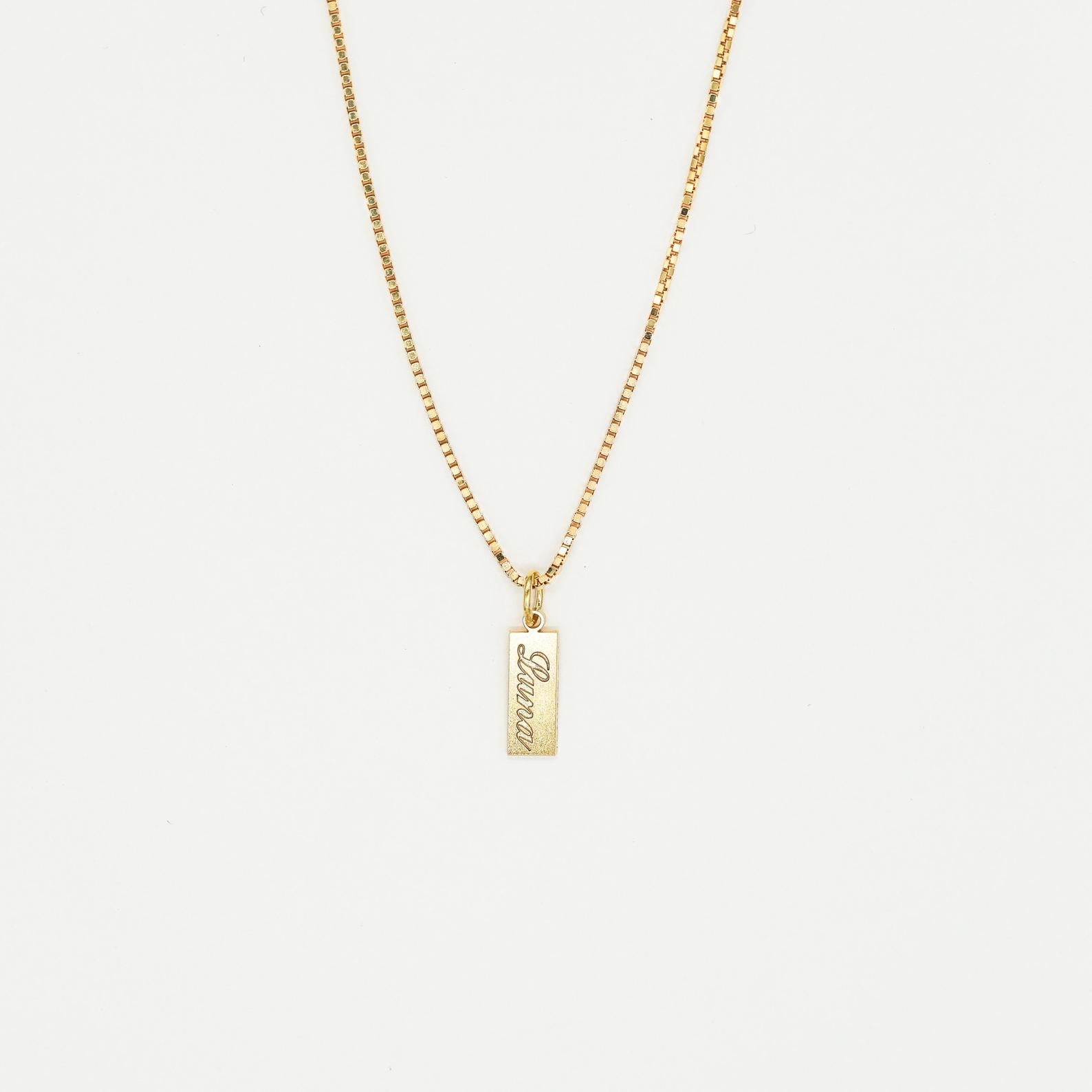 The Dainty Tag Name Necklace in Rose Gold features a rectangular pendant engraved with "love," showcased on a plain white background. This elegant and timeless piece is perfect for everyday wear.