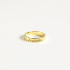 Chic Ann Engraved Name Ring displayed on a clean white background. This elegant jewelry piece can be personalized with any name for a unique touch to your style.