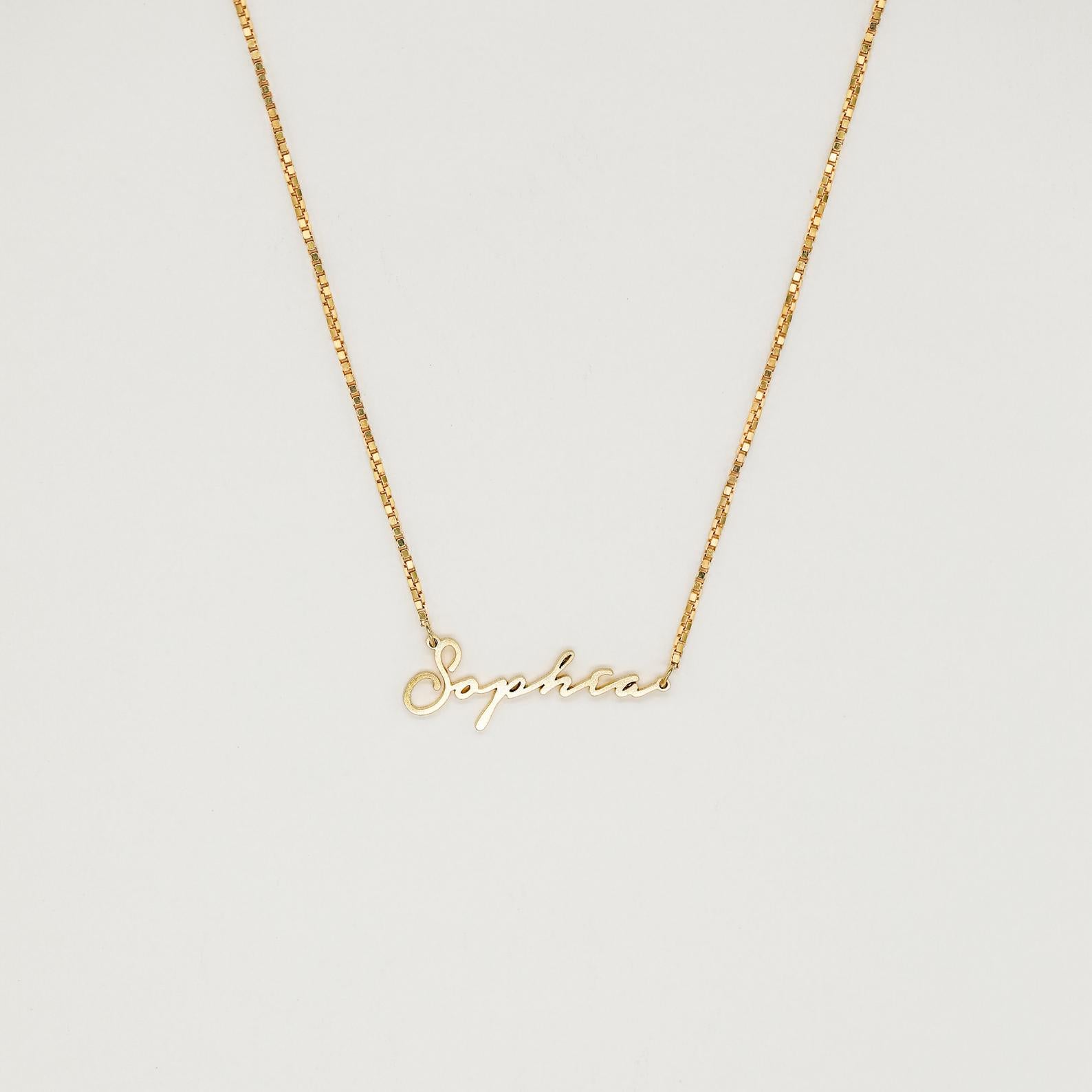 Venice Name Necklace in Box Chain featuring a dainty cursive pendant, displayed against a simple light background.