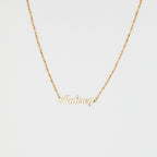 The Mellow Name Necklace in Box Chain features "Aubrey" in elegant cursive on a slim box chain, shown against a white background.