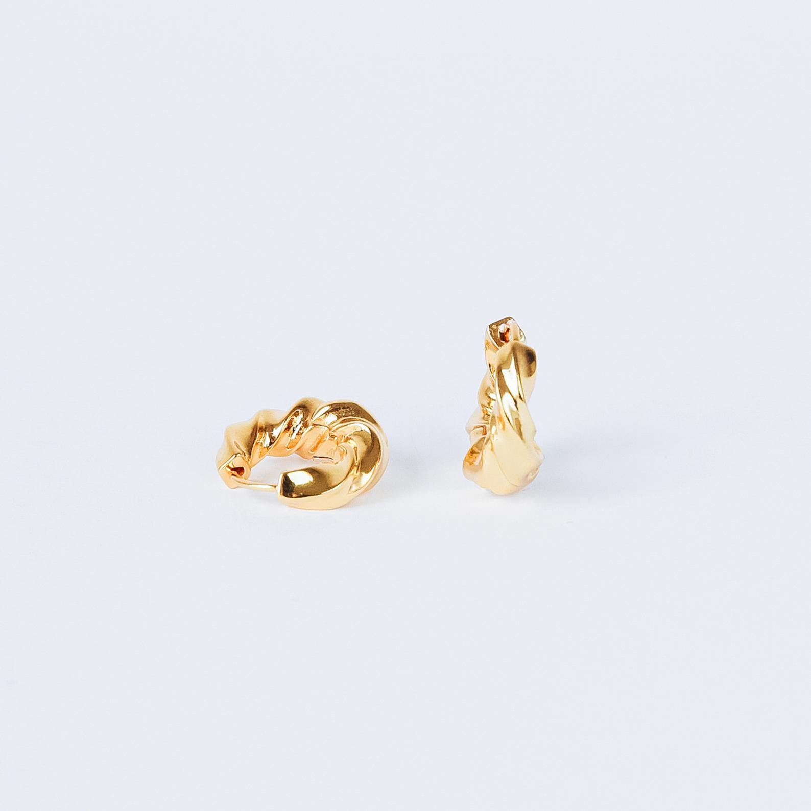 The Diana Hoops are modern gold hoop earrings that bring timeless elegance to any look.