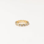 The Christy Ring features a full circle of round, sparkling diamonds set in a gold band—ideal for feminine jewelry lovers to wear solo or stacked. Shown against a white background.