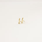 Dainty Bar Studs: these minimalist earrings are perfect for an effortless earring stack, shown on a plain light background.