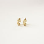 The Dainty Sphere Beaded Huggies are minimalistic gold hoop earrings with a delicate beaded design, displayed against a plain white background.