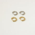 Two pairs of Dainty Sphere Beaded Huggies—one in silver, one in gold—are displayed on a light beige background.