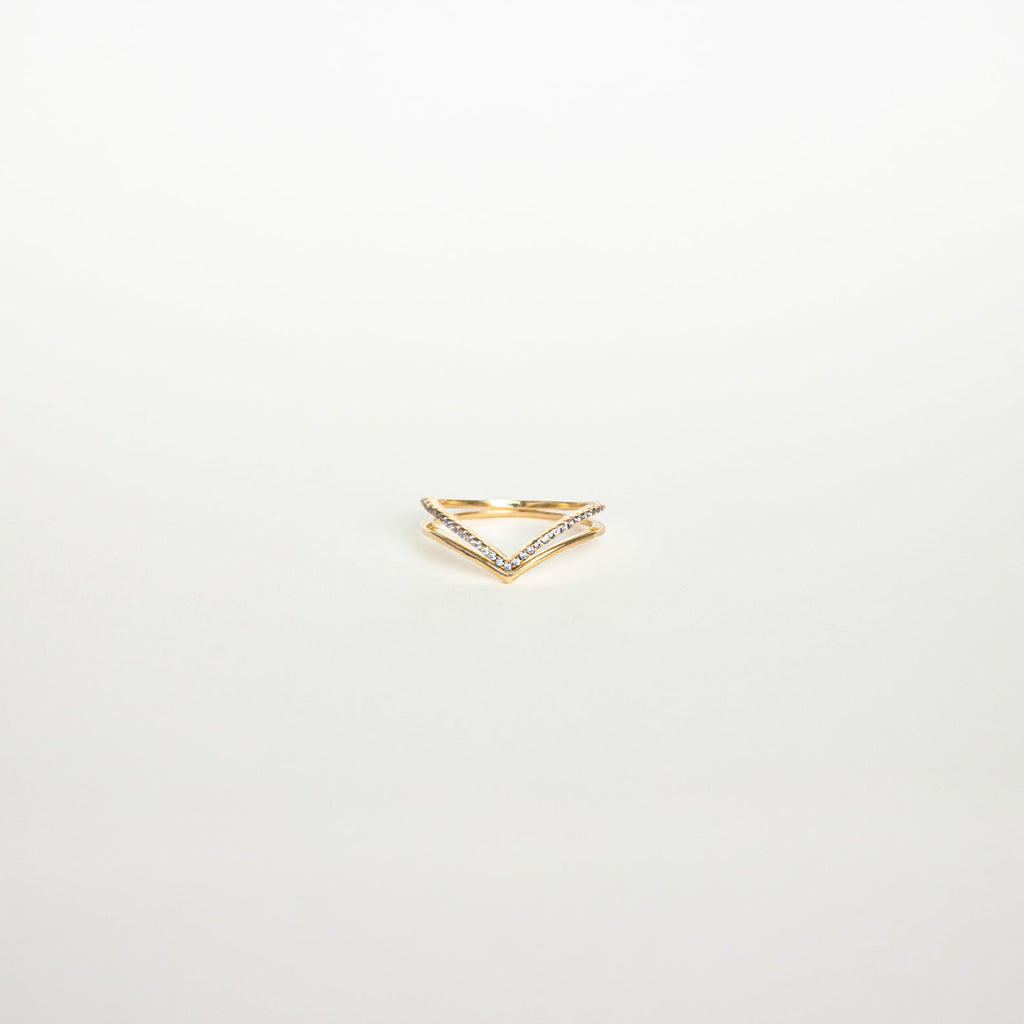Curve Stacking Set: Gold chevron-shaped ring accented with small diamonds, ideal for stacking or as a curved band, photographed on a plain white background.