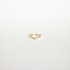 Curve Stacking Set: Gold chevron-shaped ring accented with small diamonds, ideal for stacking or as a curved band, photographed on a plain white background.