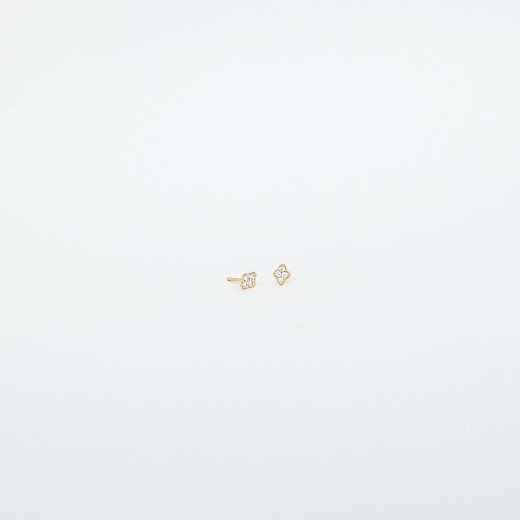 Avery Geometric Diamond Studs: Small gold diamond-shaped studs with tiny clear pavé stones, shown against a plain white background.