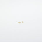 Avery Geometric Diamond Studs: Small gold diamond-shaped studs with tiny clear pavé stones, shown against a plain white background.