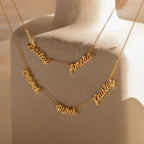 Two Paris Multiple Name Necklaces are displayed on a beige mannequin bust, each featuring names in elegant cursive script and adorned with a Parisian-inspired charm.