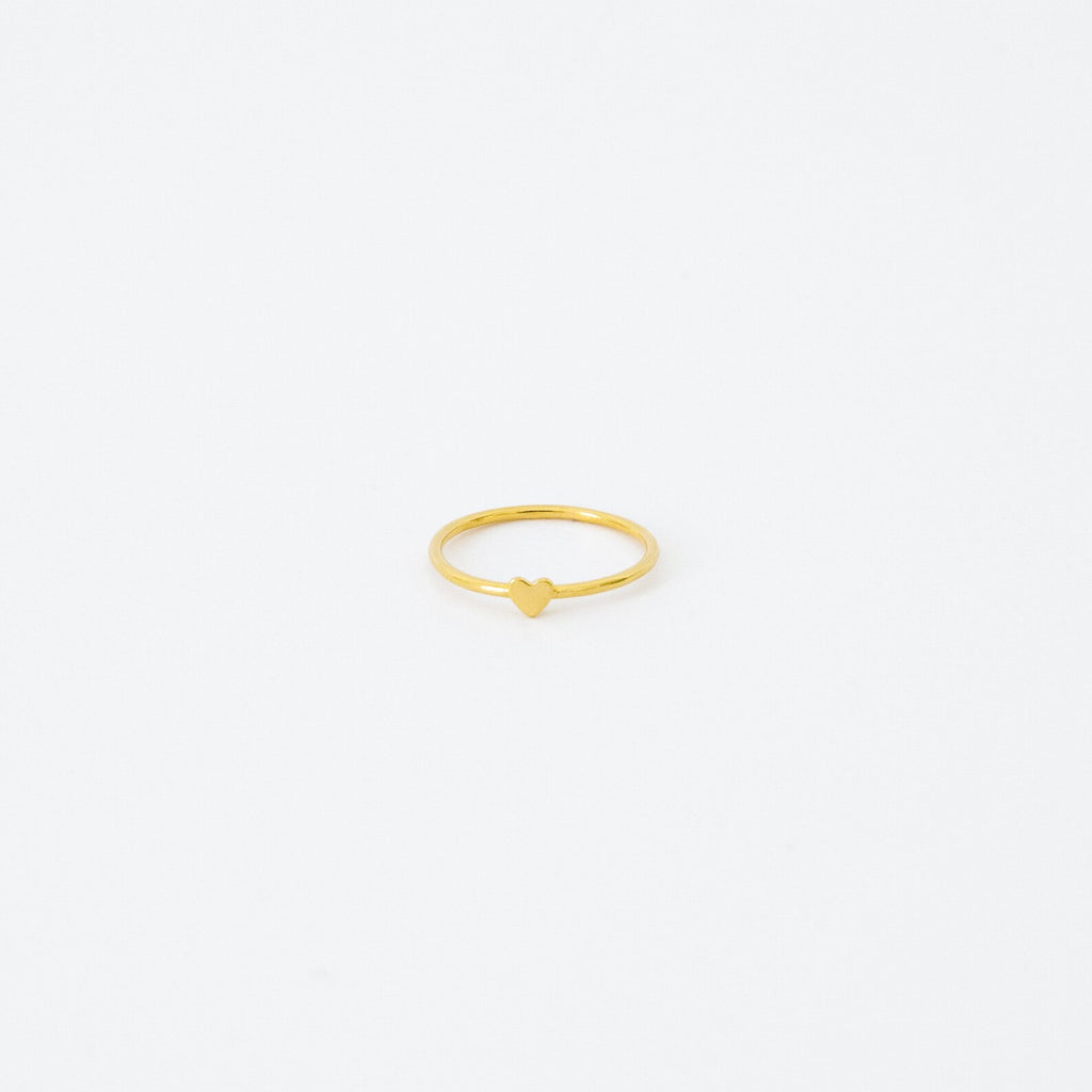 The Nala Tiny Heart Ring in gold is a delicate and dainty piece, ideal as a promise ring or for stacking with your favorite rings.