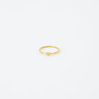 The Nala Tiny Heart Ring in gold is a delicate and dainty piece, ideal as a promise ring or for stacking with your favorite rings.