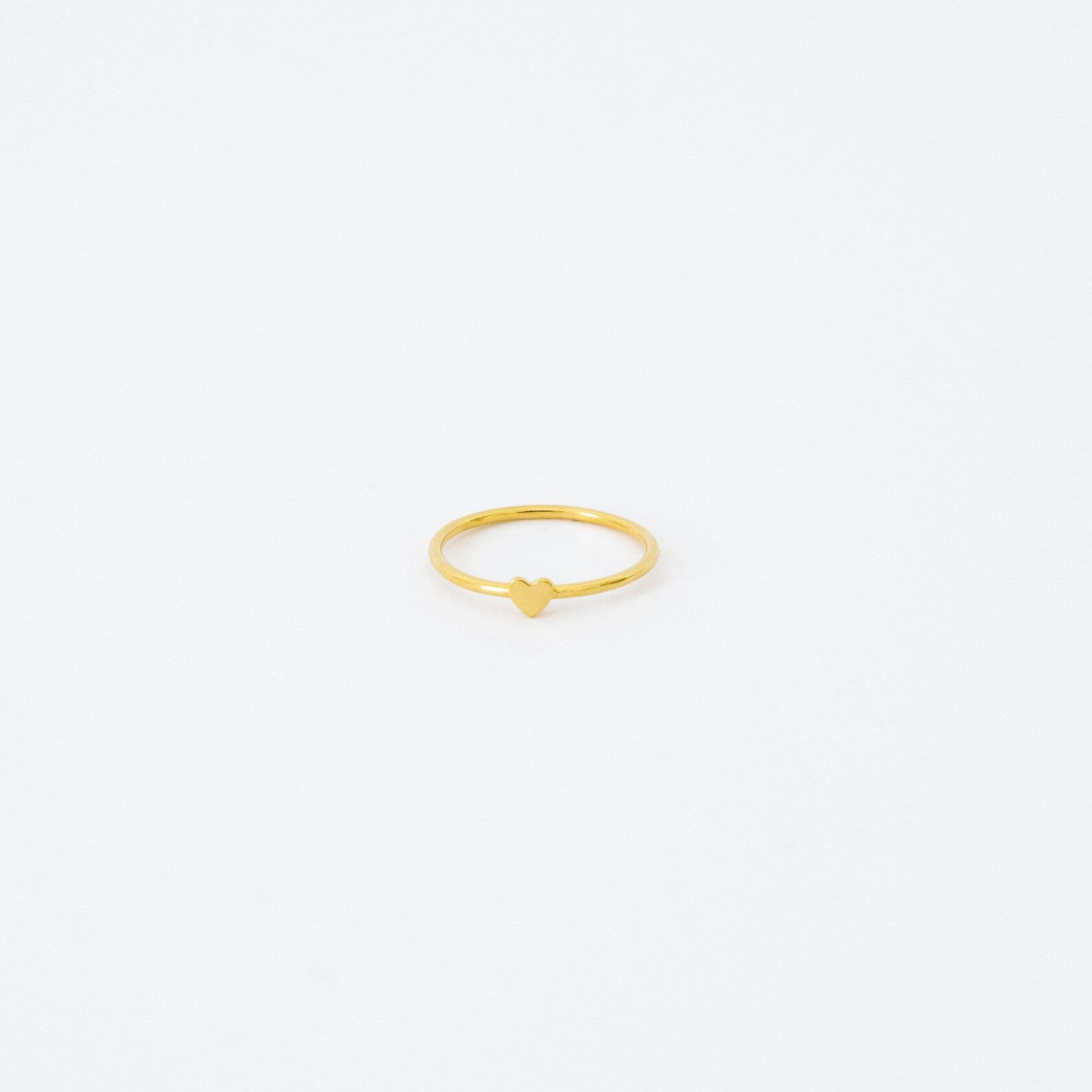 The Nala Tiny Heart Ring in gold is a delicate and dainty piece, ideal as a promise ring or for stacking with your favorite rings.