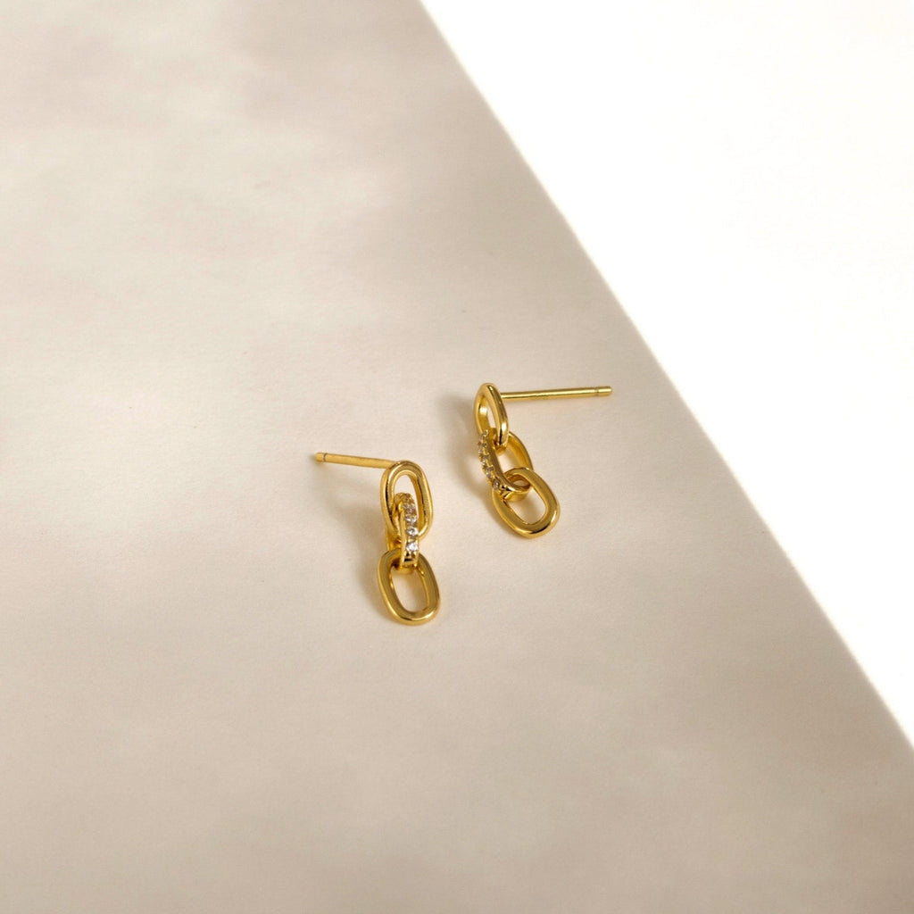 Add a touch of elegance with the Amia Pave Link Earrings, featuring a classic gold finish and sparkling pavé accents in a stylish paperclip link chain design.
