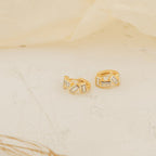 Glacier Baguette Huggies are gold earrings featuring a minimalistic design and dazzling diamonds for subtle sparkle.