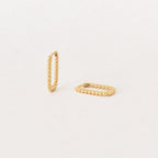 The Indiana Beaded Hoops, a pair of chic gold earrings, are displayed on a plain, light background.