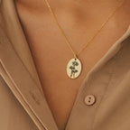 Oval Flower Necklace in Rose Gold featuring a floral-engraved oval pendant, styled over a tan button-up shirt—a thoughtful gift for her.