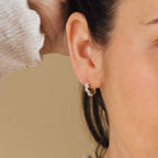 Model wearing gold Sprinkle Diamond Huggies