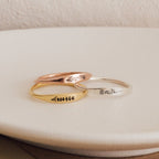 The Skinny Flower Ring in Rose Gold features a delicate engraved botanical design—perfect for stacking with other minimalist bands.