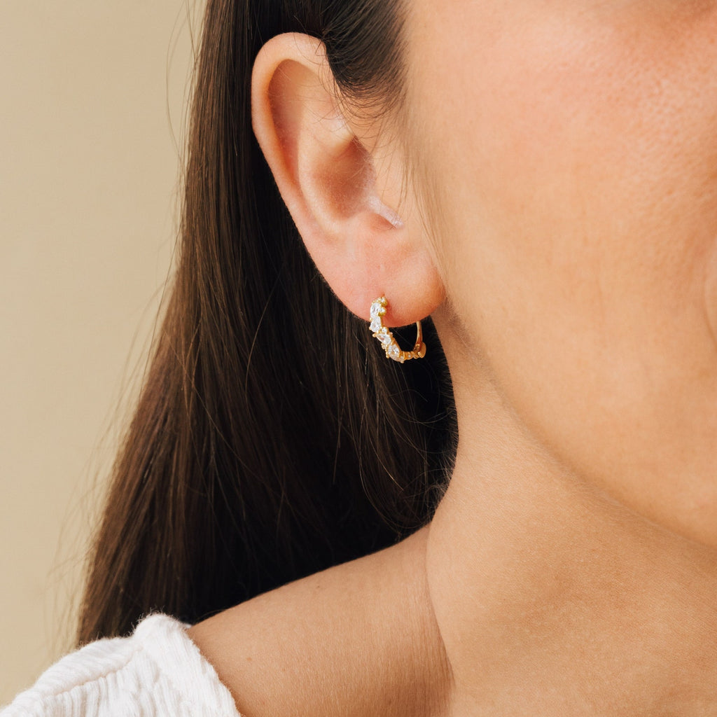 Model wearing gold Sprinkle Diamond Huggies