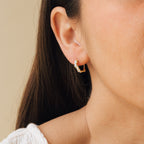 Model wearing gold Sprinkle Diamond Huggies