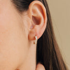 Model wearing gold Sprinkle Diamond Huggies 