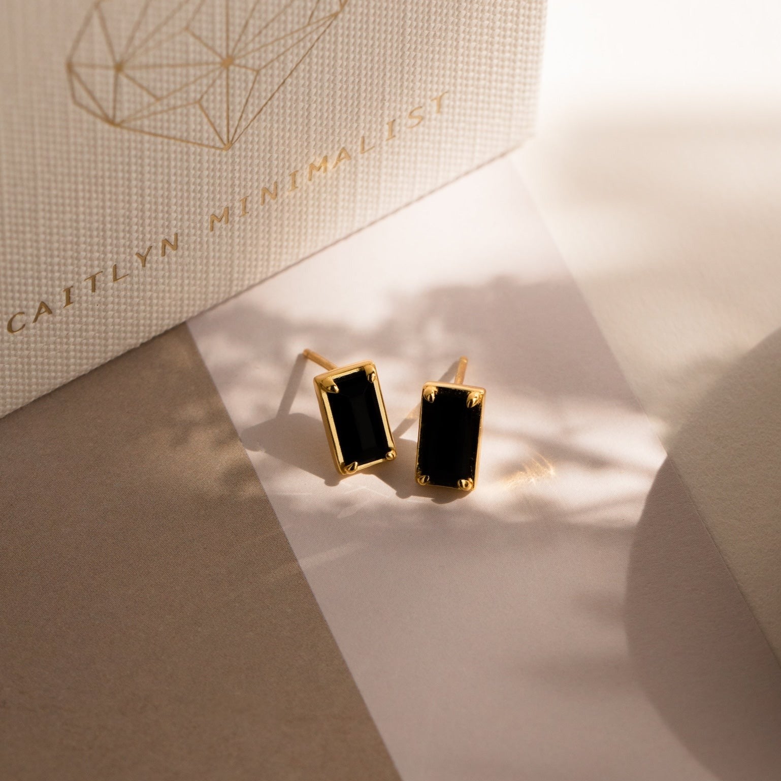 Rectangle Black Onyx Studs shown on a neutral background with Caitlyn Minimalist packaging, ideal for anyone who loves vintage-inspired earrings with a modern edge.