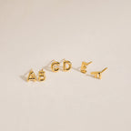 Five gold Bubble Letter Studs—A, B, C, D, and E—displayed on a neutral background. Ideal for personalized style or as a thoughtful bridesmaid gift.