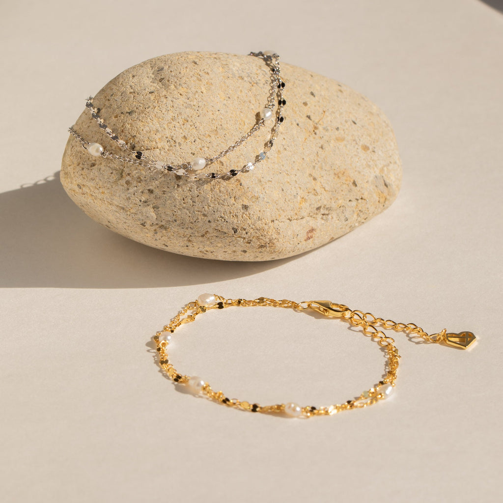 Detail shot of the bracelet’s gold and silver tones, highlighting the contrast between the rich gold and cool silver, as well as the adjustable fit and polished finish.