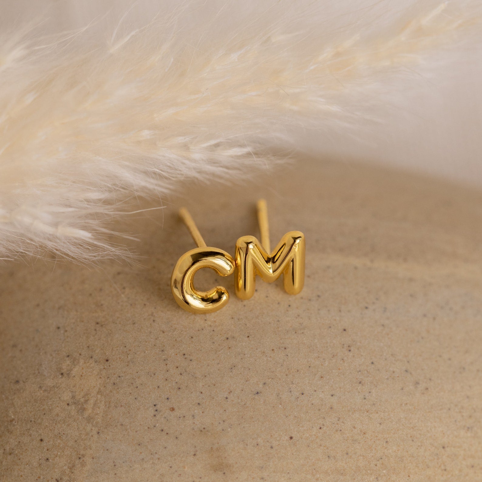 Bubble Letter Studs are gold initial charm earrings—stylish, personalized accessories that make a perfect gift for bridesmaids or anyone special.