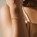 The Venus Diamond Station Bracelet—a delicate gold piece with sparkling diamond stations—adds elegance to any outfit, making it a stunning choice for wedding jewelry or an unforgettable anniversary gift.