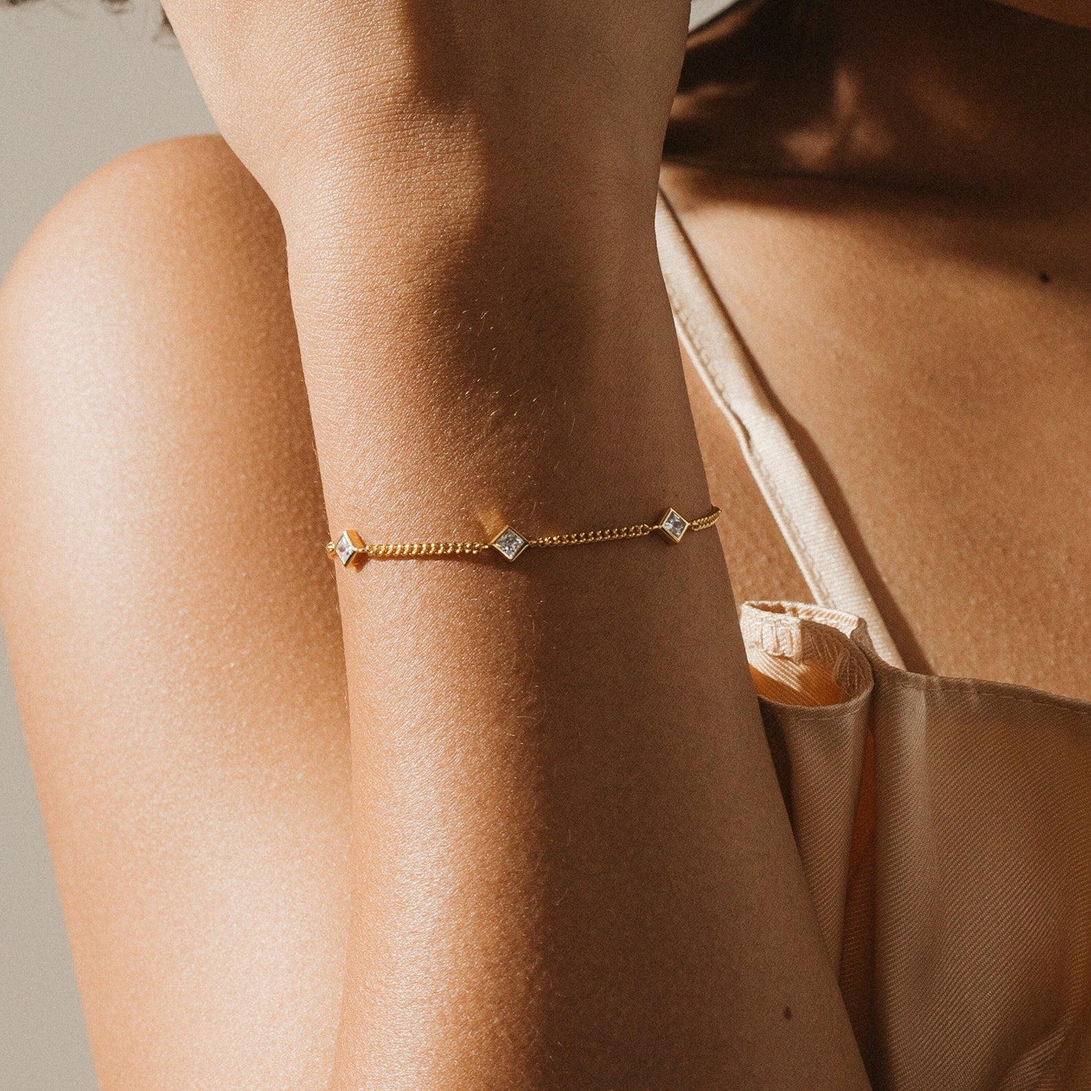 The Venus Diamond Station Bracelet—a delicate gold piece with sparkling diamond stations—adds elegance to any outfit, making it a stunning choice for wedding jewelry or an unforgettable anniversary gift.