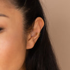 A close-up of a woman's ear adorned with a Claw Ear Cuff, highlighting the elegance of Claw Ear Cuffs and their dainty, sophisticated style.