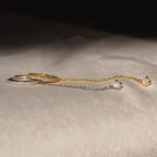 The Opal Stud & Pave Hoop Earrings set features two delicate chain earrings, one gold and one silver with crystal accents—perfect for mixing and matching for versatile style.